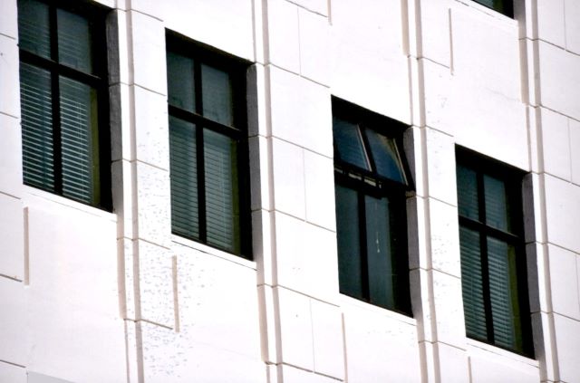 After: exterior view of new compatible windows after rehabilitation